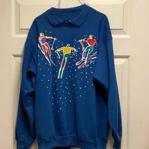 Colorful skiers on a fancy sweatshirt matches a coat on my Poshmark. Size M